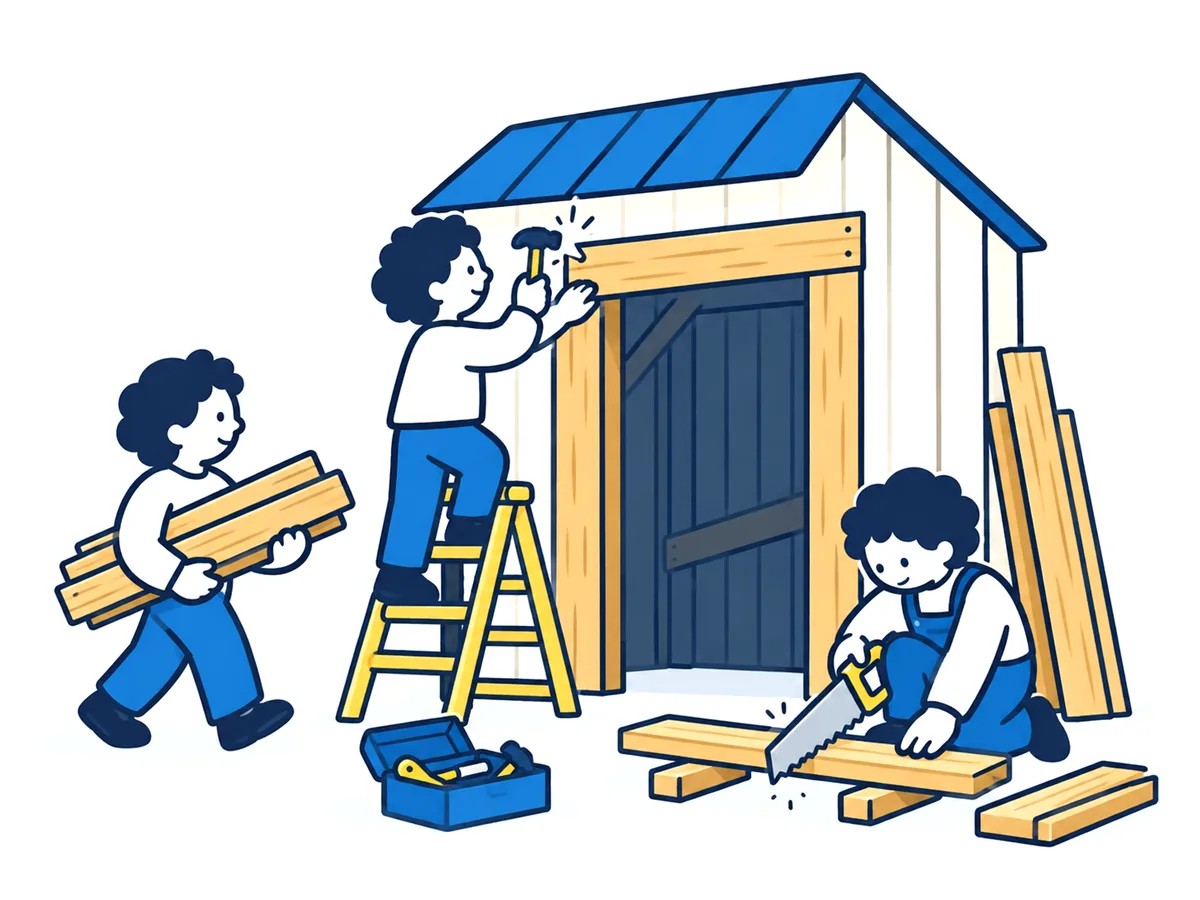 倉庫の入口を、仲間と板を打ちつけて改装する人たち